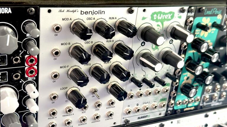 Benjolin module beside other Eurorack modules with black knobs on silver panels